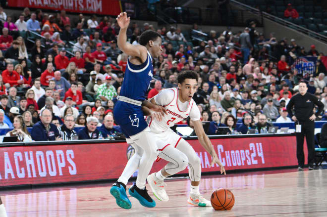Fairfield Stags guard Brycen Goodine (2) drives to the basket while being defended by St. Peter's Peacocks guard Roy Clarke (4) during the first half at Jim Whelan Boardwalk Hall.