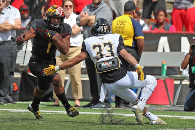 D.J. Moore (No. 1) had 163 all-purpose yards and three touchdowns against Towson.