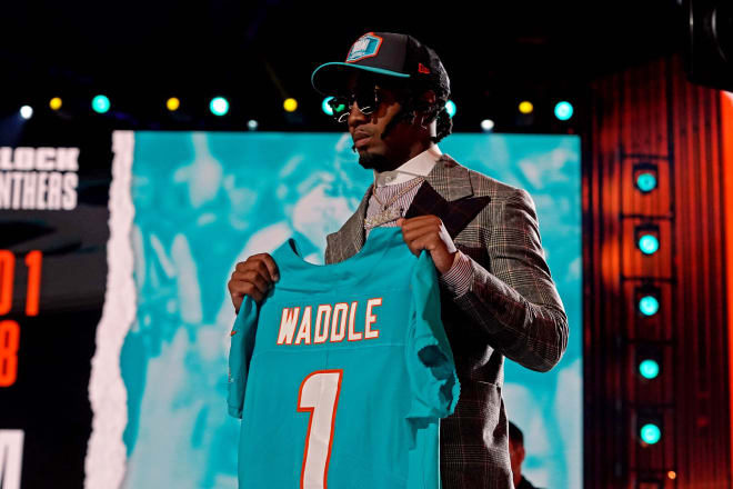 Jaylen Waddle (Alabama) poses with a jersey after being selected by Miami Dolphins as the number six overall pick in the first round of the 2021 NFL Draft at First Energy Stadium. Photo | USA Today