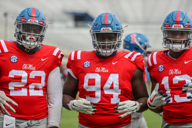 Ole Miss defensive linemen Tariqious Tisdale (22), Quentin Bivens (94) and Sam Williams (13) enjoy a moment during Saturday's scrimmage at Vaught-Hemingway Stadium.