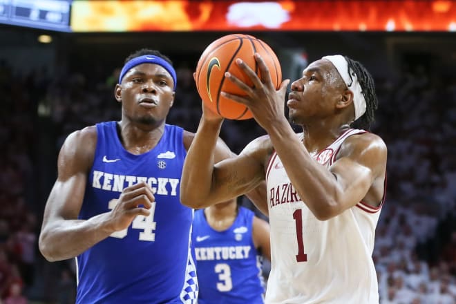 Arkansas' JD Notae (1) drove to the basket against Kentucky's Oscar Thsiebwe (34) during the matchup between the Razorbacks and Wildcats at Bud Walton Arena in Fayetteville.