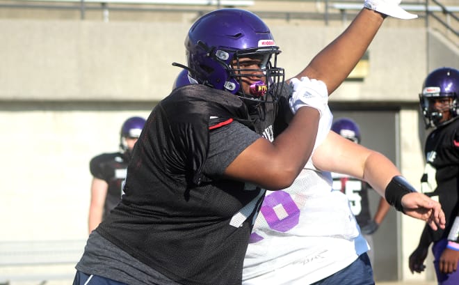 Indiana defensive tackle Kenneth Grant holds a Michigan Wolverines football recruiting offer from Jim Harbaugh.
