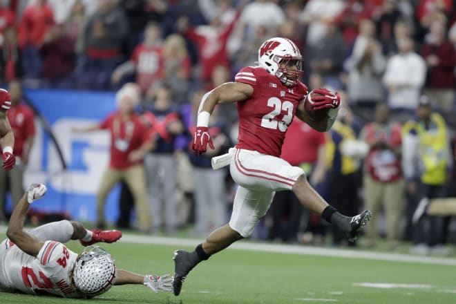 Wisconsin running back Jonathan Taylor (23) runs for a touchdown past Ohio State.