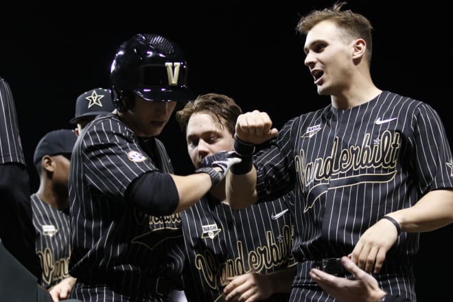 Vanderbilt celebrates some early-inning success in a 15-9 win over Virginia. 