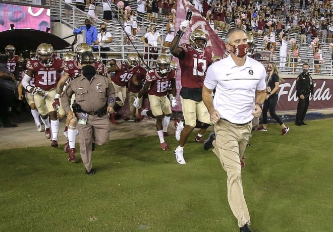 FSU coach Mike Norvell leads the Seminoles onto the field Saturday to face North Carolina.