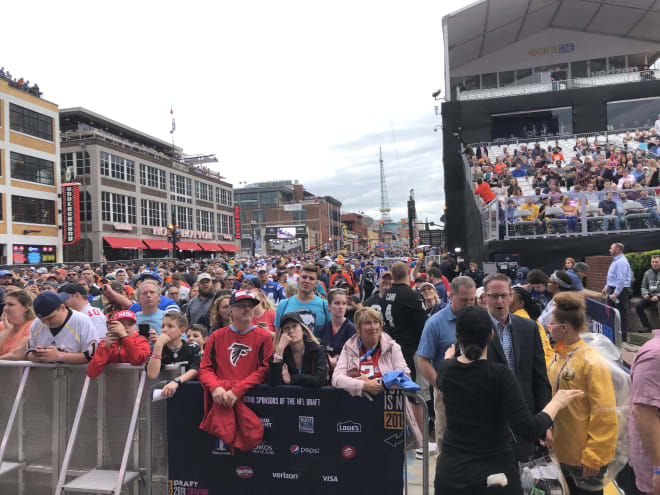 Fans lined Broadway for the NFL Draft's first round on Thursday night.