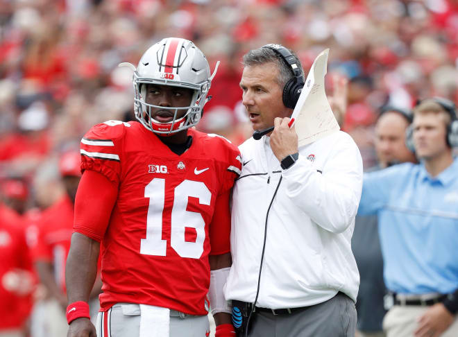 Ohio State Buckeyes head coach Urban Meyer talks to quarterback J.T. Barrett #16 during the game against the Rutgers Scarlet Knights at Ohio Stadium on October 1, 2016 in Columbus, Ohio.