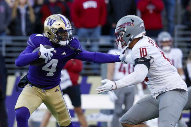 Washington Huskies wide receiver Germie Bernard (4) breaks a tackle attempt by Washington State Cougars defensive end Ron Stone Jr. (10) during the first quarter at Alaska Airlines Field at Husky Stadium. Photo | Joe Nicholson-USA TODAY Sports