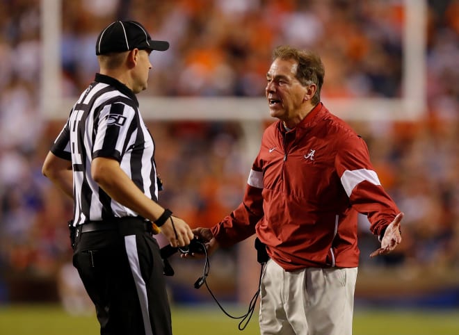 Alabama Crimson Tide head coach Nick Saban argues with a referee during a game against Auburn. Photo | Getty Images