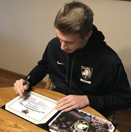 Punter Zach Harding signs on the dotted line