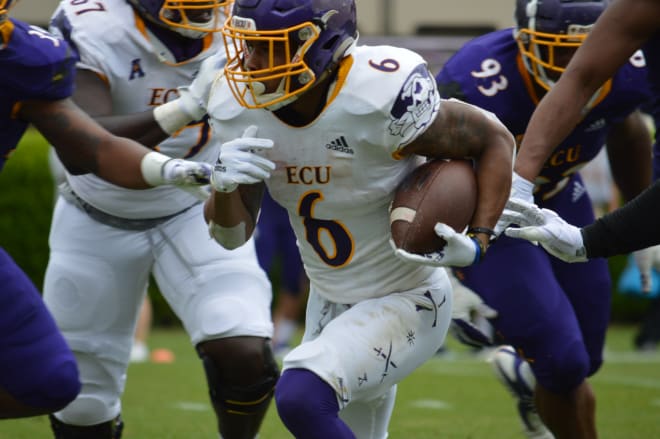 ECU running back Hussein Howe finds daylight in the ECU defense in Saturday's annual spring game.