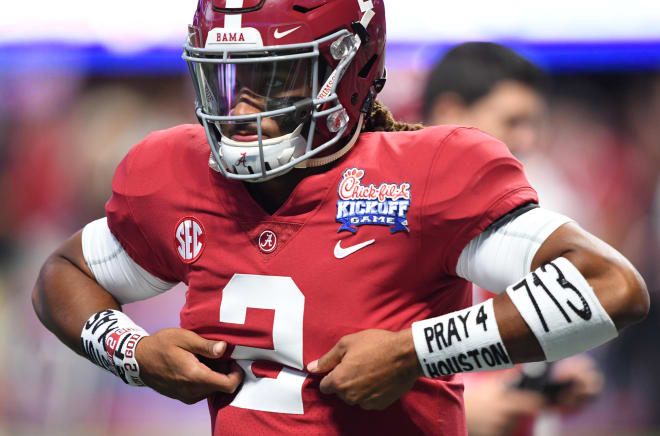 Alabama Crimson Tide quarterback Jalen Hurts (2) wears wrist bands drawing attention to the victims of Hurricane Harvey as he warms up before a game against the Florida State Seminoles at Mercedes-Benz Stadium.  Photo | USA Today