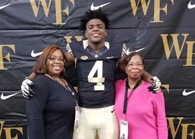 Chaney's mom and grandma flank him during his visit this past weekend