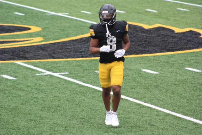 Terrell Washington goes through warmups at Iowa's open spring practice. 