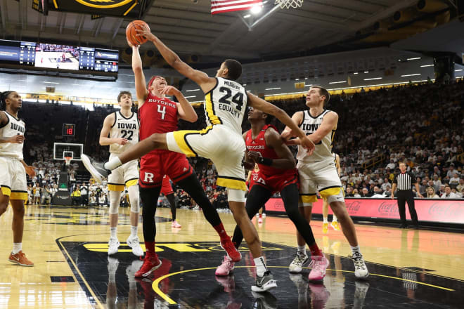 Kris Murray blocks Paul Mulcahy during Iowa's 93-82 victory over Rutgers on Sunday. © Reese Strickland-USA TODAY Sports