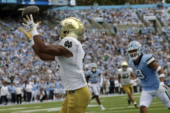 Lorenzo Styles hauls in a TD reception on a pass from Drew Pyne Saturday in Notre Dame's 45-32 romp at North Carolina.