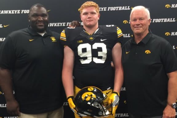 Class of 2021 DT Griffin Liddle with Iowa coaches Kelvin Bell and Reese Morgan.