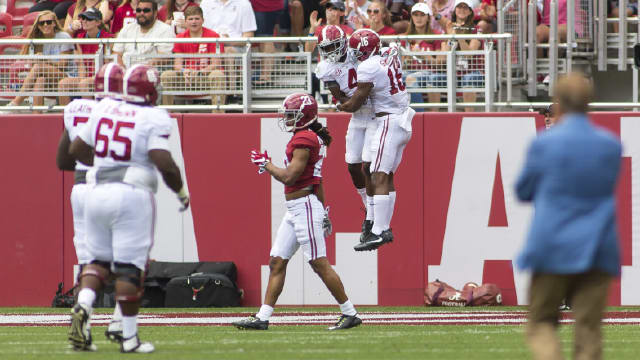 Alabama receivers Jerry Jeudy (4) and T.J. Simmons (16) celebrate after a touchdown during the A-Day game. Photo | Laura Chramer