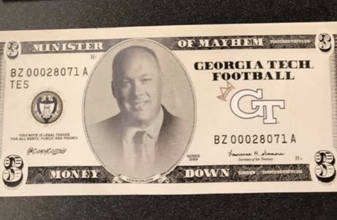 Georgia Tech students threw $3 Geoff Collins "Minister Of Mayhem" bills in the air on third downs.