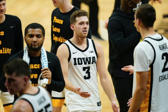 Jordan Bohannon scored 10 of his 16 points in the final four minutes to lead Iowa to a win in the regular season finale