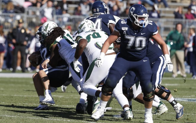 Oct 5, 2019; East Hartford, CT; South Florida Bulls linebacker Dwayne Boyles (11) sacks Connecticut Huskies quarterback Mike Beaudry (12) at Pratt & Whitney Stadium at Rentschler Field. 