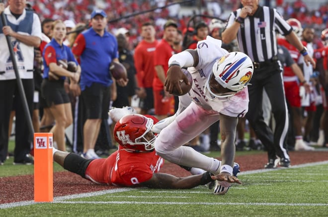 Kansas quarterback Jalon Daniels stretches for the end zone against Houston last weekend. 