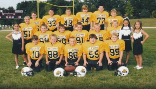 Drew (top row, far right) was always the biggest kid in his class.  Everyone else in the back row of this photo is standing on risers.