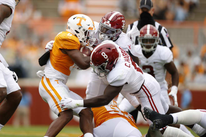 Alabama Crimson Tide linebackers Christian Harris (8) and Dylan Moses (32) make a tackle against Tennessee. Photo | SEC 