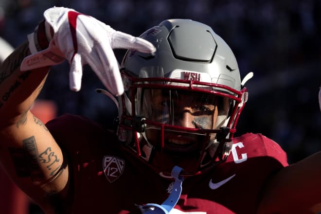 Derrick Langford celebrates after his interception return for a touchdown in the third quarter Saturday against Arizona.