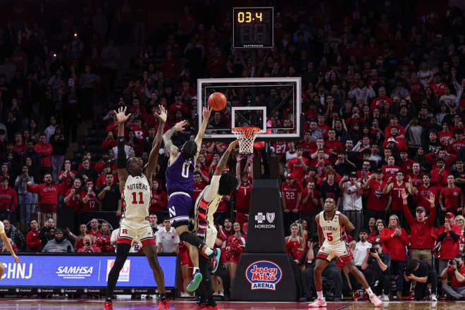 Buie's shot out of a double team on Northwestern's final possession fell well short after controversial contact wasn't called a foul.
