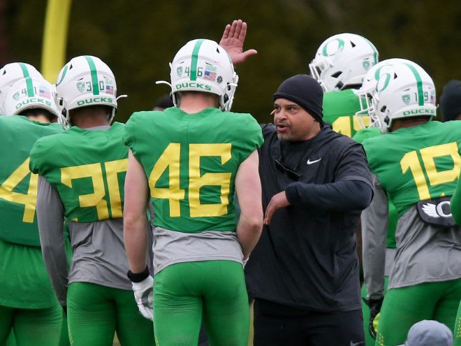 Demetrice Martin talks with Oregon players during a spring practice with the Ducks on April 6, 2023.