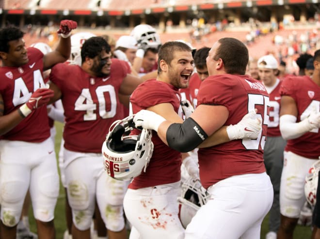 Lance Keneley and Drake Metcalf embrace after defeating the Sun Devils. 