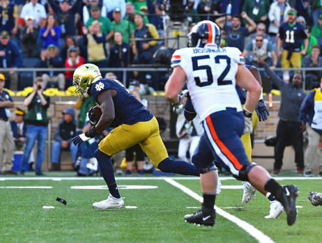 Notre Dame fifth-year senior defensive end Ade Ogundeji returning a fumble for a touchdown against Virginia in 2019