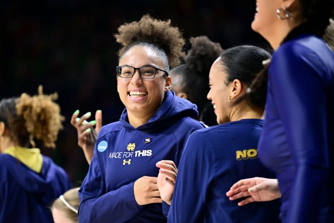 Notre Dame junior Olivia Miles celebrates a first-round NCAA Tourney victory on Saturday with her teammates.