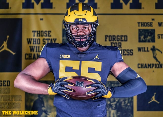 Rivals100 defensive lineman Rayshaun Benny holds a Michigan Wolverines football recruiting offer from Jim Harbaugh.