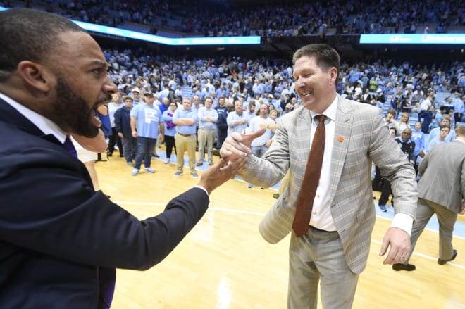 Anthony Goins (left) was hired as an assistant for Mike White's basketball team.