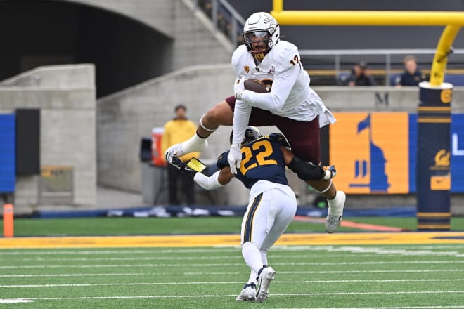 Jalin Conyers leaping over a Cal defender earlier this season. 