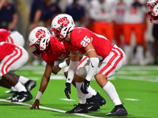 DE prospect Cal Varner (hand in ground) and OLB prospect Shepherd Bowling (two point stance) of Katy High School