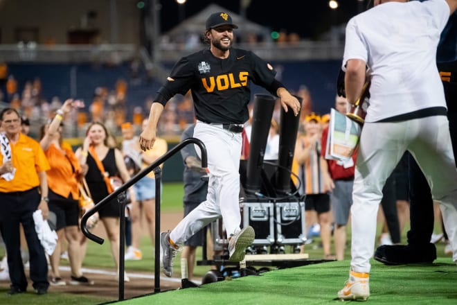 Tennessee head coach Tony Vitello jumps on stage for the trophy presentation after game three of the NCAA College World Series finals between Tennessee and Texas A&M at Charles Schwab Field in Omaha, Neb., on Monday, June 24, 2024.