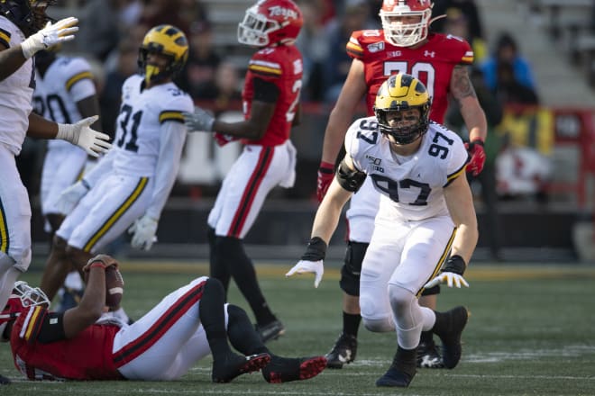 Michigan Wolverines football sophomore defensive end Aidan Hutchinson celebrates a sack.