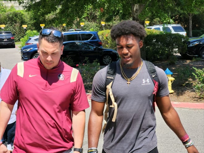 FSU quarterbacks coach Tony Tokarz meet up at the start of Chris Parson's Elite Camp visit.