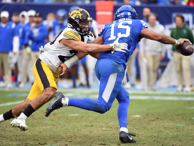 Kentucky Wildcats quarterback Destin Wade (15) is sacked by Iowa Hawkeyes defensive back Sebastian Castro (29) during the second half in the 2022 Music City Bowl at Nissan Stadium.