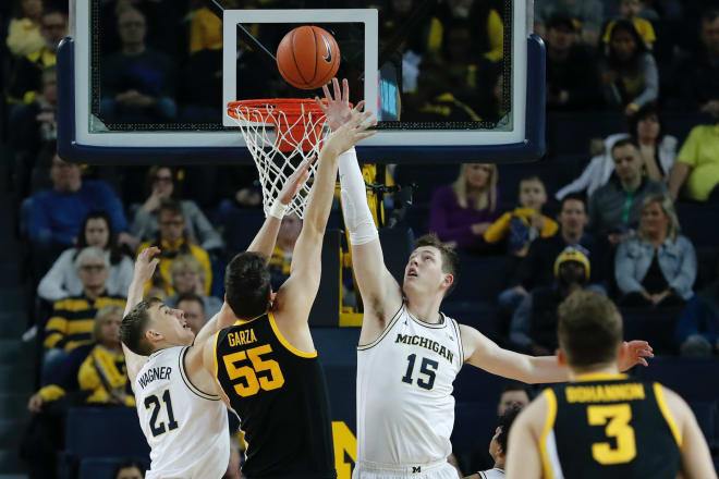 The Michigan Wolverines' basketball team defeated Iowa at Crisler in the two teams' first meeting, 103-91.