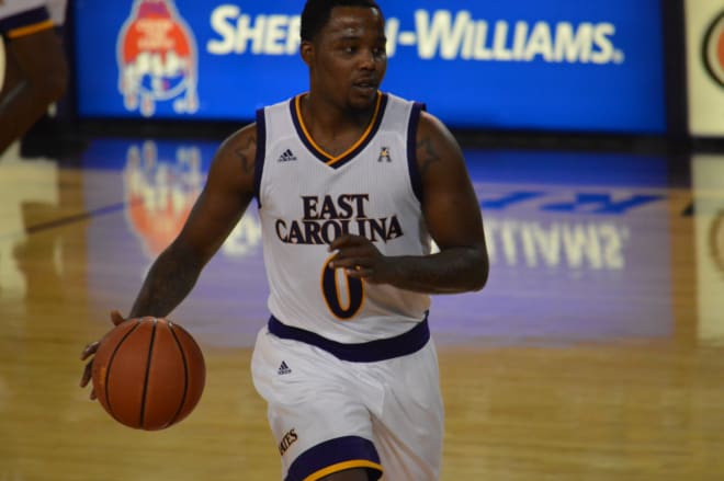 ECU guard Isaac Fleming and the Pirates fall at Trask Coliseum to UNC-W 95-86 Tuesday night.