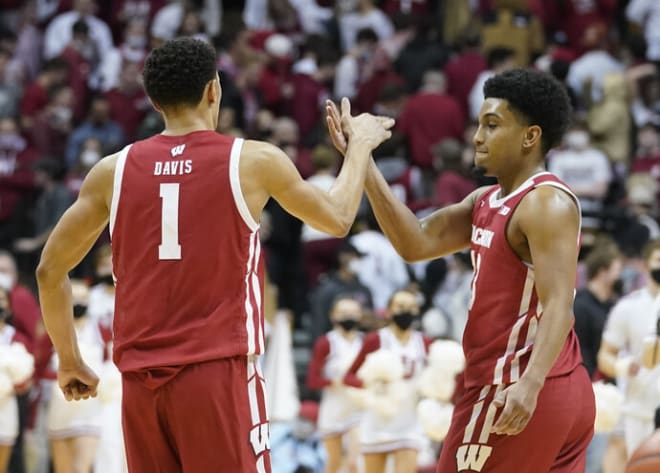 Wisconsin's Johnny Davis (1) and Chucky Hepburn (23) celebrate after their 74-69 win over Indiana. The Badgers are 12-1 in games decided by six points or less..