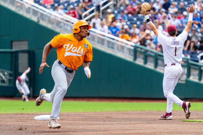 Jun 19, 2024; Omaha, NE, USA; Tennessee Volunteers second baseman Christian Moore (1) runs to third against the Florida State Seminoles during the first inning at Charles Schwab Field Omaha. 
