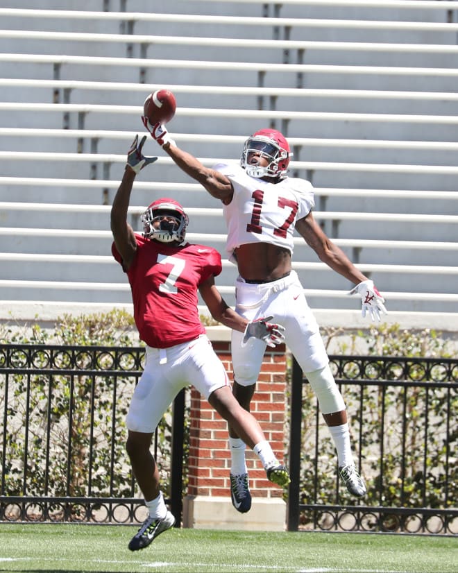 Alabama receiver Cam Sims appears to make a one-handed catch over cornerback Trevon Diggs. Sims later admitted to dropping the ball on the play. Photo | Alabama Athletics