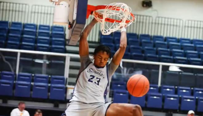 Jaylen Wharton slams down a dunk at Walters State College in Tennessee 