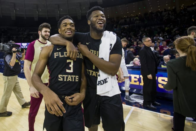 RaiQuan Gray (right) hugs Trent Forrest after he hit the game-winning shot for FSU basketball on Wednesday night at Notre Dame. 