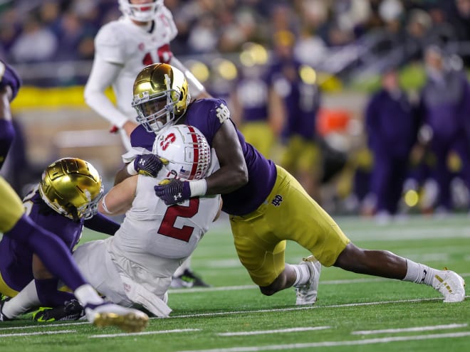 Defensive end Nana Osafo-Mensah, top, has been an important leader for Notre Dame this year.